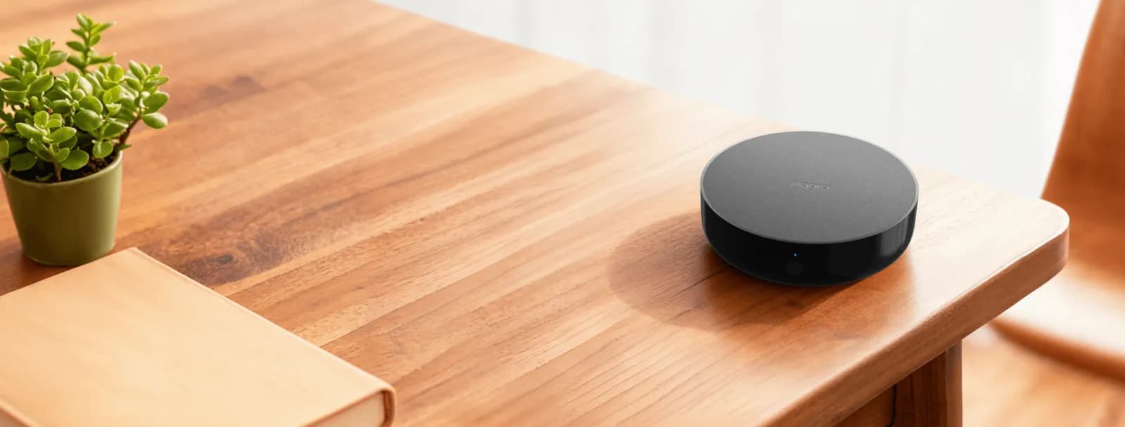 Aqara Hub M200 on a wooden table